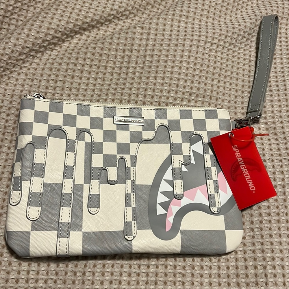 Limited edition Sprayground wristlet bag.